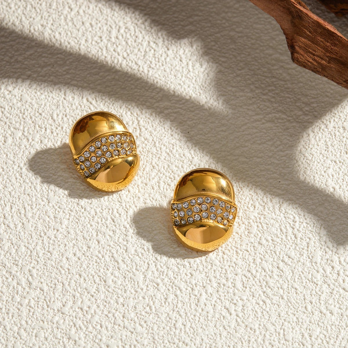 Elegant gold-tone dome earrings with cubic zirconia sparkle, stylish luxe jewellery perfect for festive look & gifting.