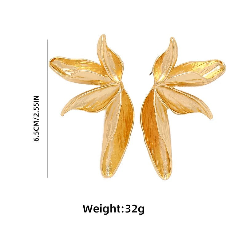 Gold leaf-shaped earrings with measurements and weight information on a white background