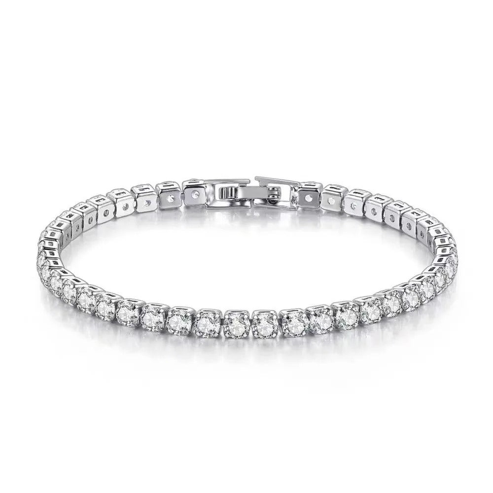 Silver bracelet with clear stones on a white background