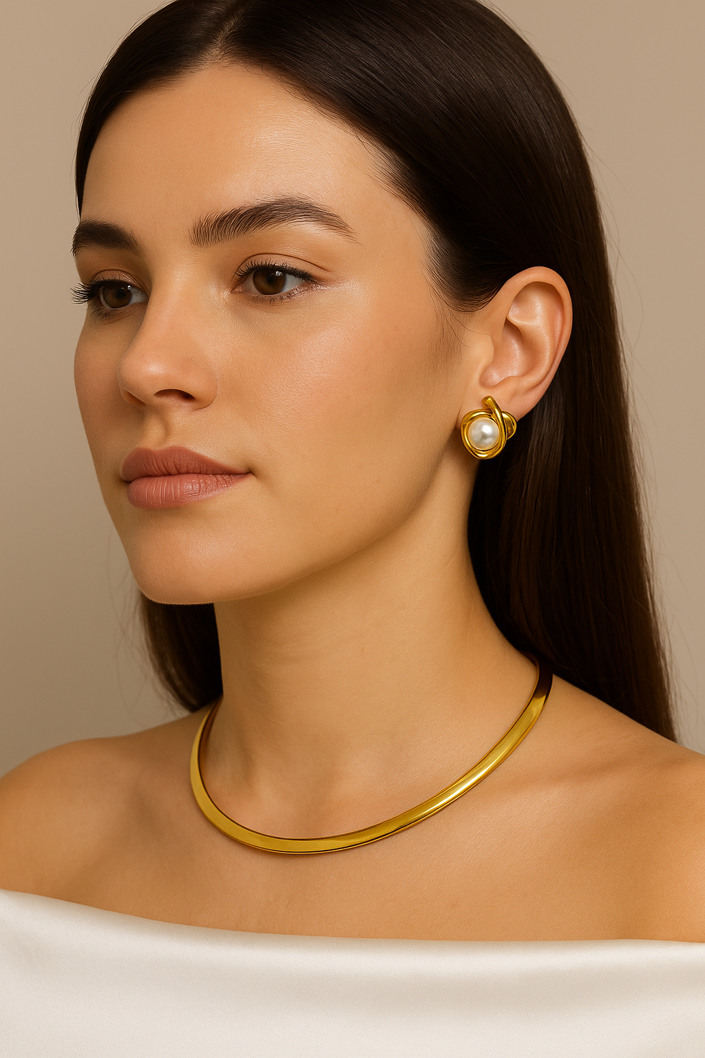 Elegant woman wearing a gold-plated choker necklace paired with statement pearl stud earrings – minimal and classy jewelry look