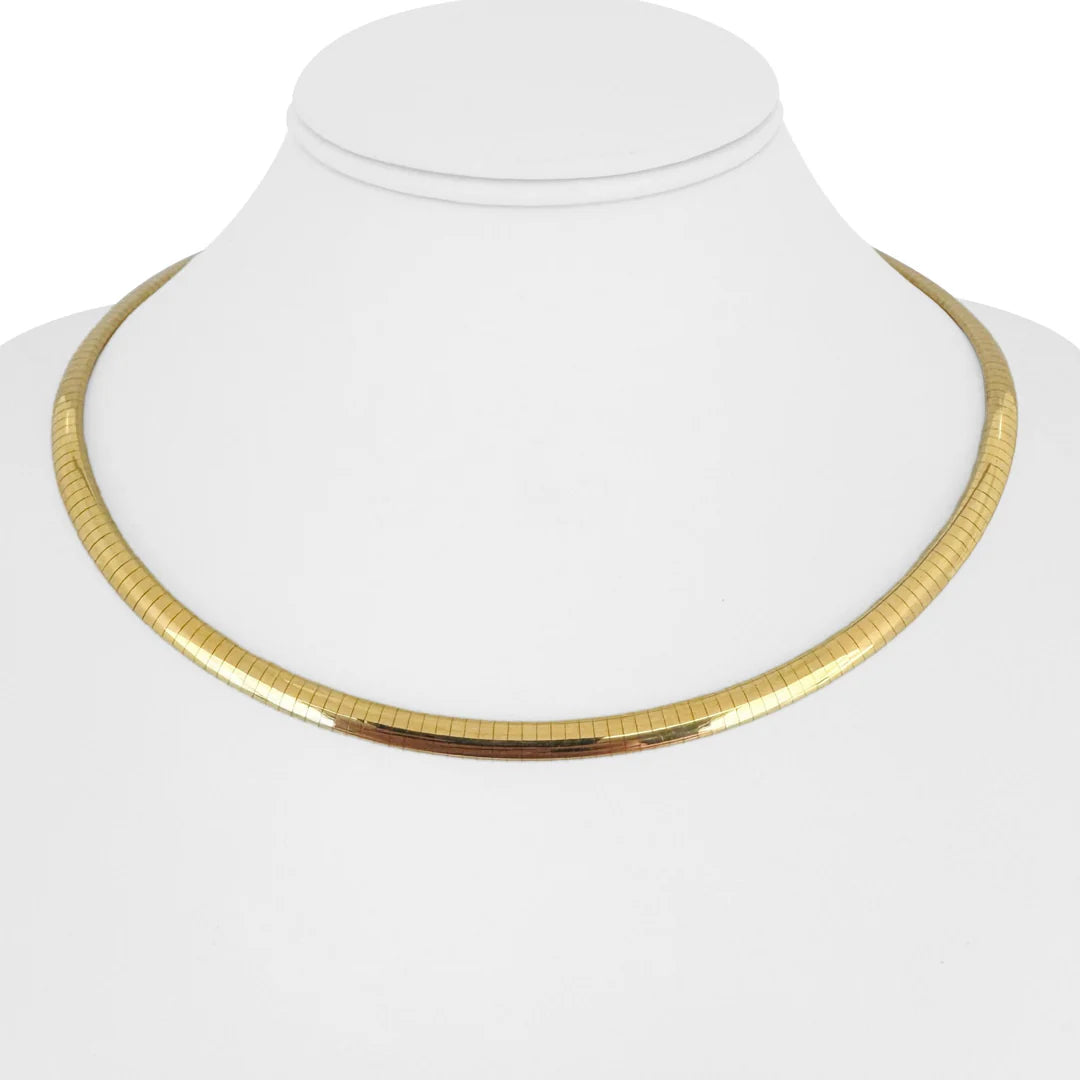 Classic gold choker necklace with flat snake chain design displayed on a white mannequin bust.