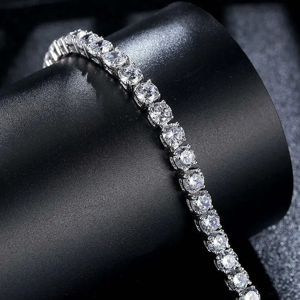 Diamond tennis bracelet on a dark surface