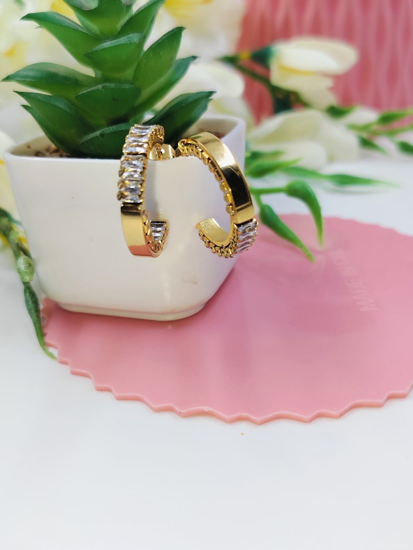 Trendy gold hoop earrings with shiny white stones, elegant lightweight jewelry for weddings, parties and daily style.