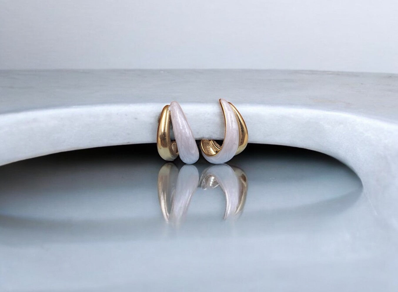 Stylish gold and white enamel hoop earrings for women, chic lightweight jewelry perfect for daily wear and special occasions.