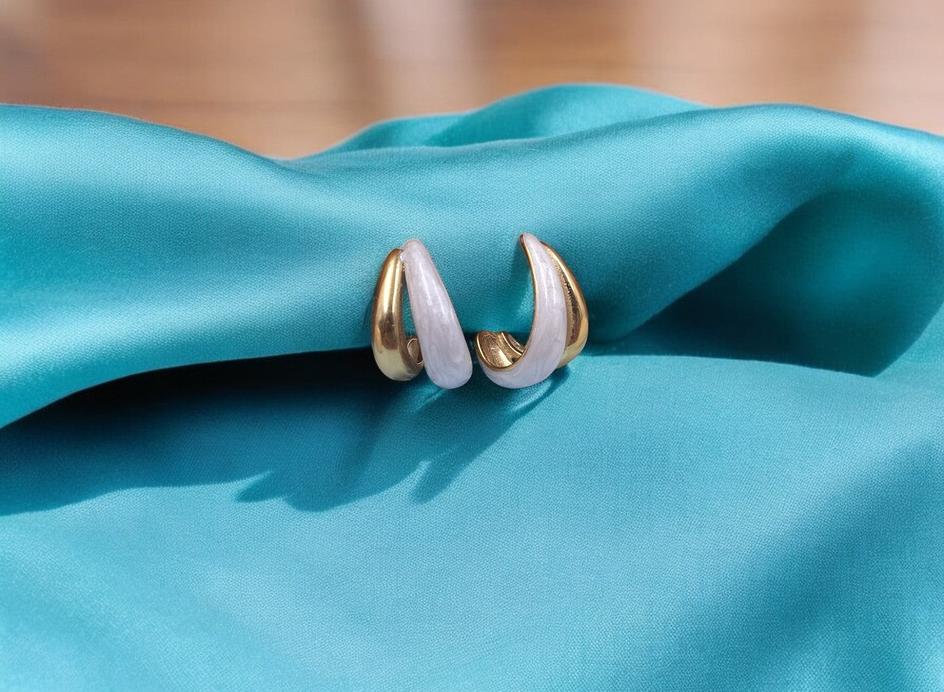 Elegant gold and white enamel hoop earrings for women, lightweight statement jewelry perfect for casual and party wear.