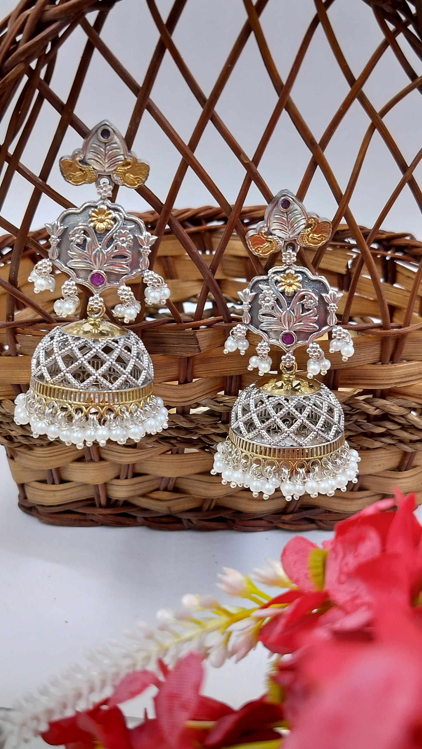 Antique silver jhumkas with golden dome & pearl drops – a timeless festive essential.