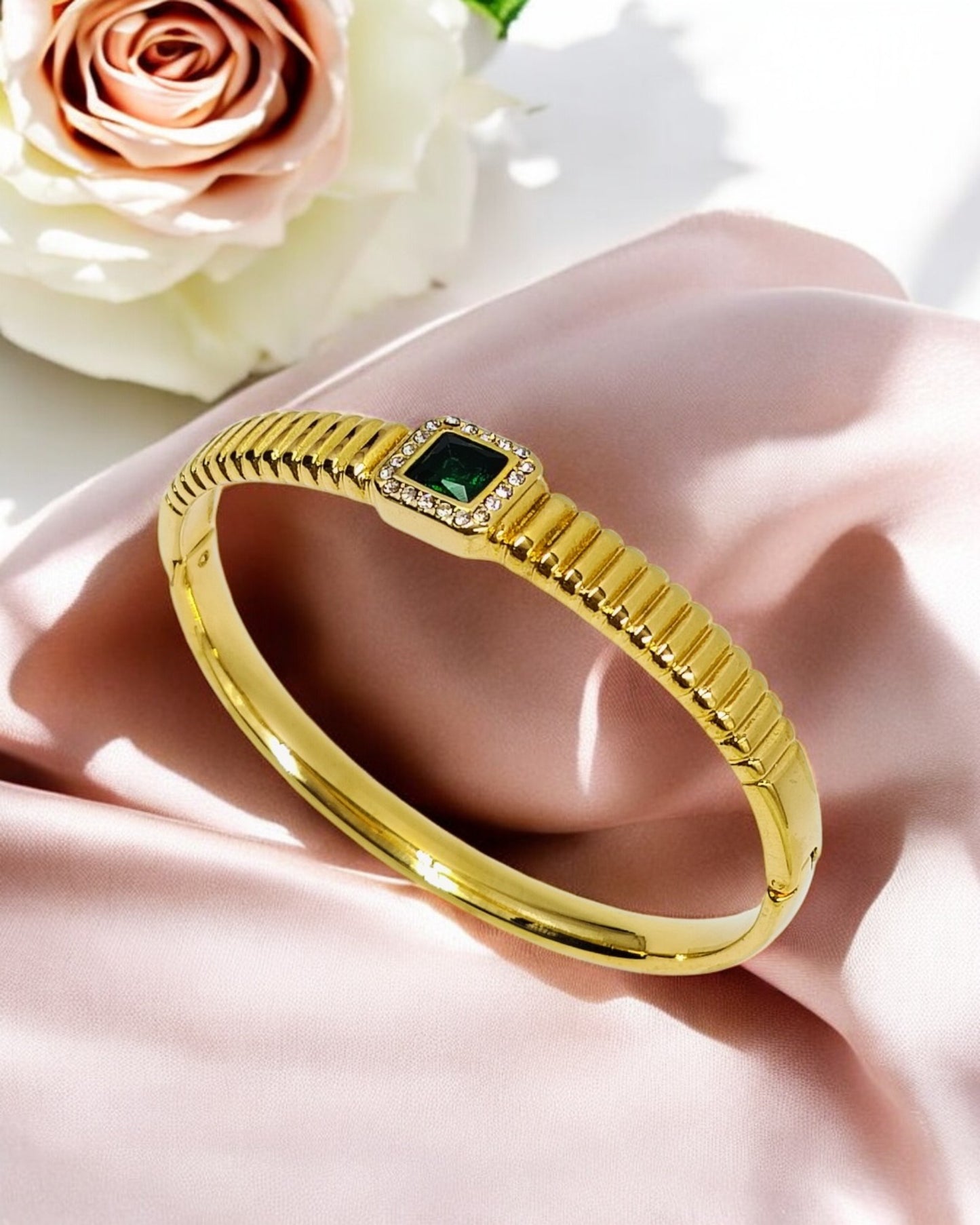 Elegant gold plated bracelet with green stone centerpiece, classy women’s jewelry perfect for parties, gifting and daily wear.
