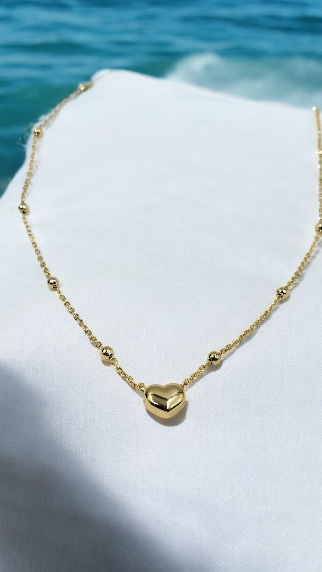 Trendy gold plated heart pendant necklace for women, stylish lightweight jewelry perfect for vacations and daily wear.