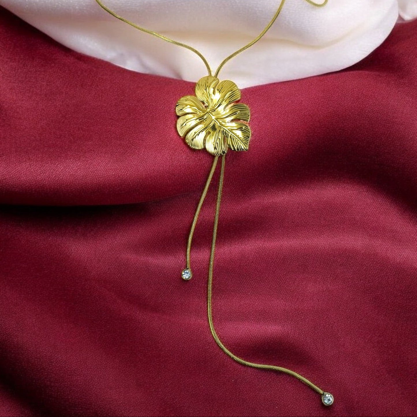 Elegant gold floral pendant necklace with adjustable long chain and crystal drops, statement jewelry for parties and special occasions.