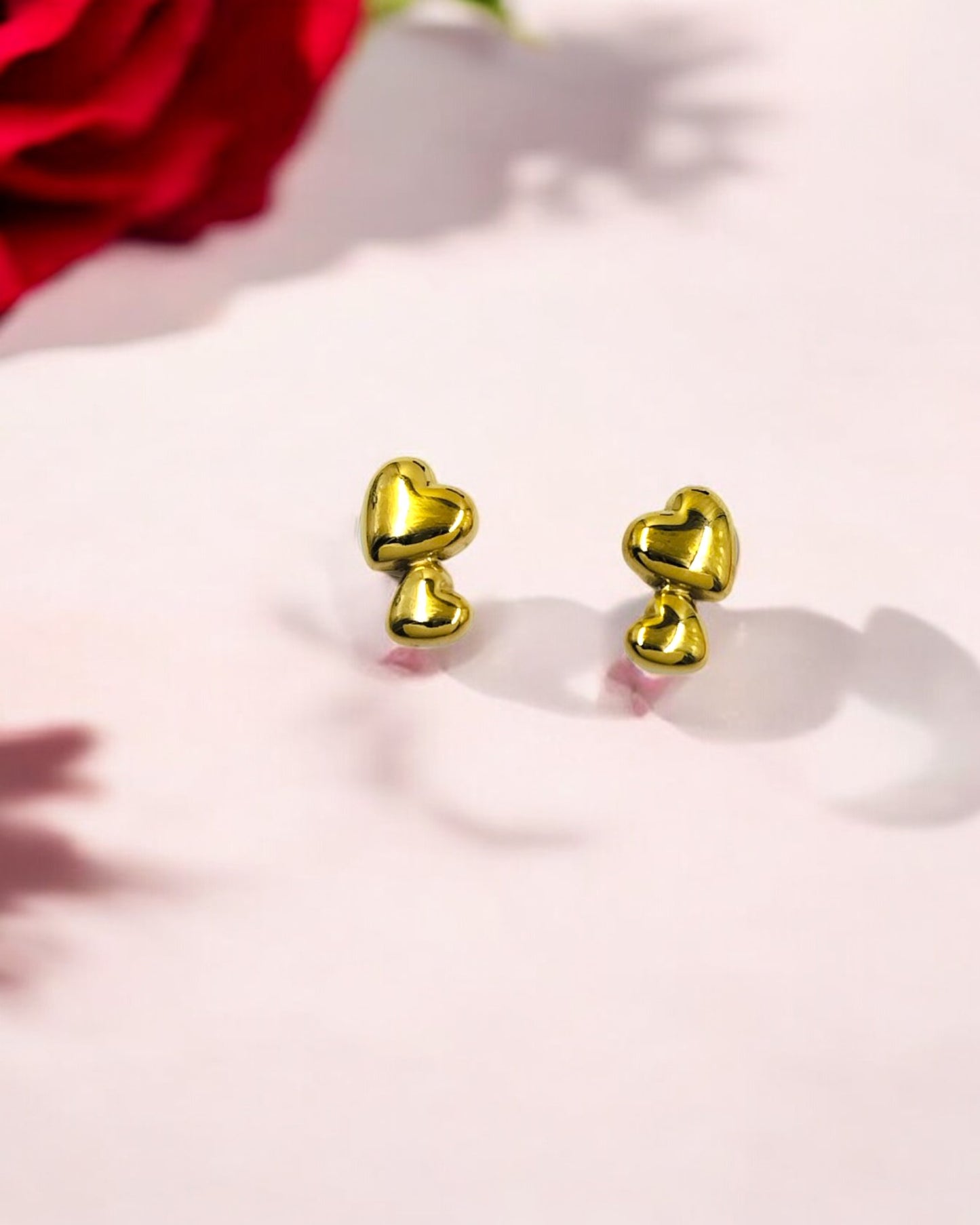 Elegant gold heart stud earrings for women, anti-tarnish lightweight design ideal for romantic dates and daily wear.