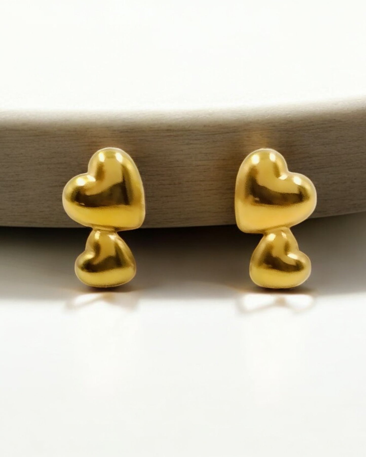 Stylish double heart gold stud earrings for women, anti-tarnish lightweight jewelry perfect for casual and party wear.