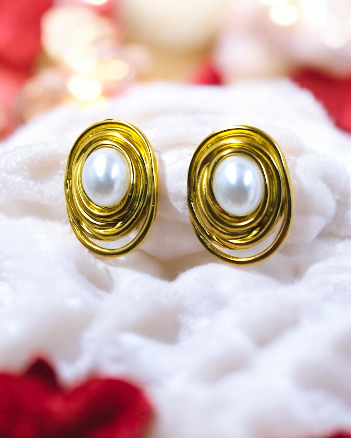 Stylish gold spiral earrings with white pearl center, modern statement jewelry for parties, weddings, and festive looks