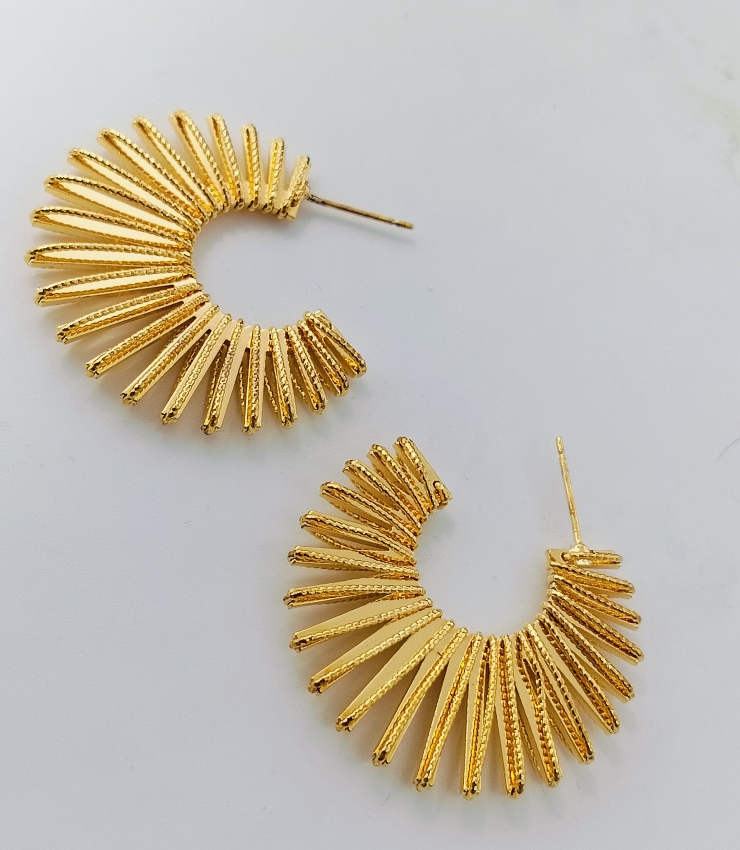 Trendy gold plated wide sunburst hoop earrings for women, bold geometric statement jewellery ideal for festive and casual wear