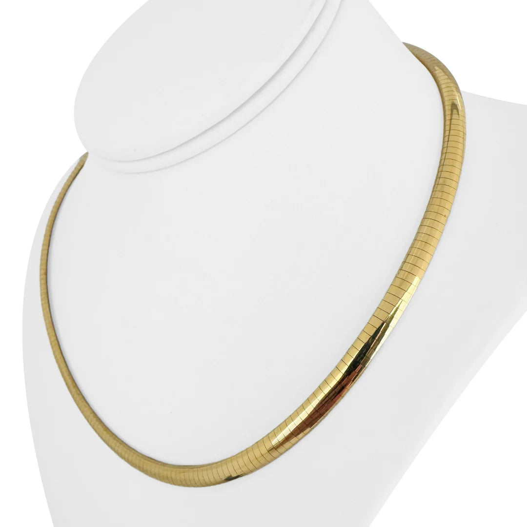 Gold necklace on a white bust