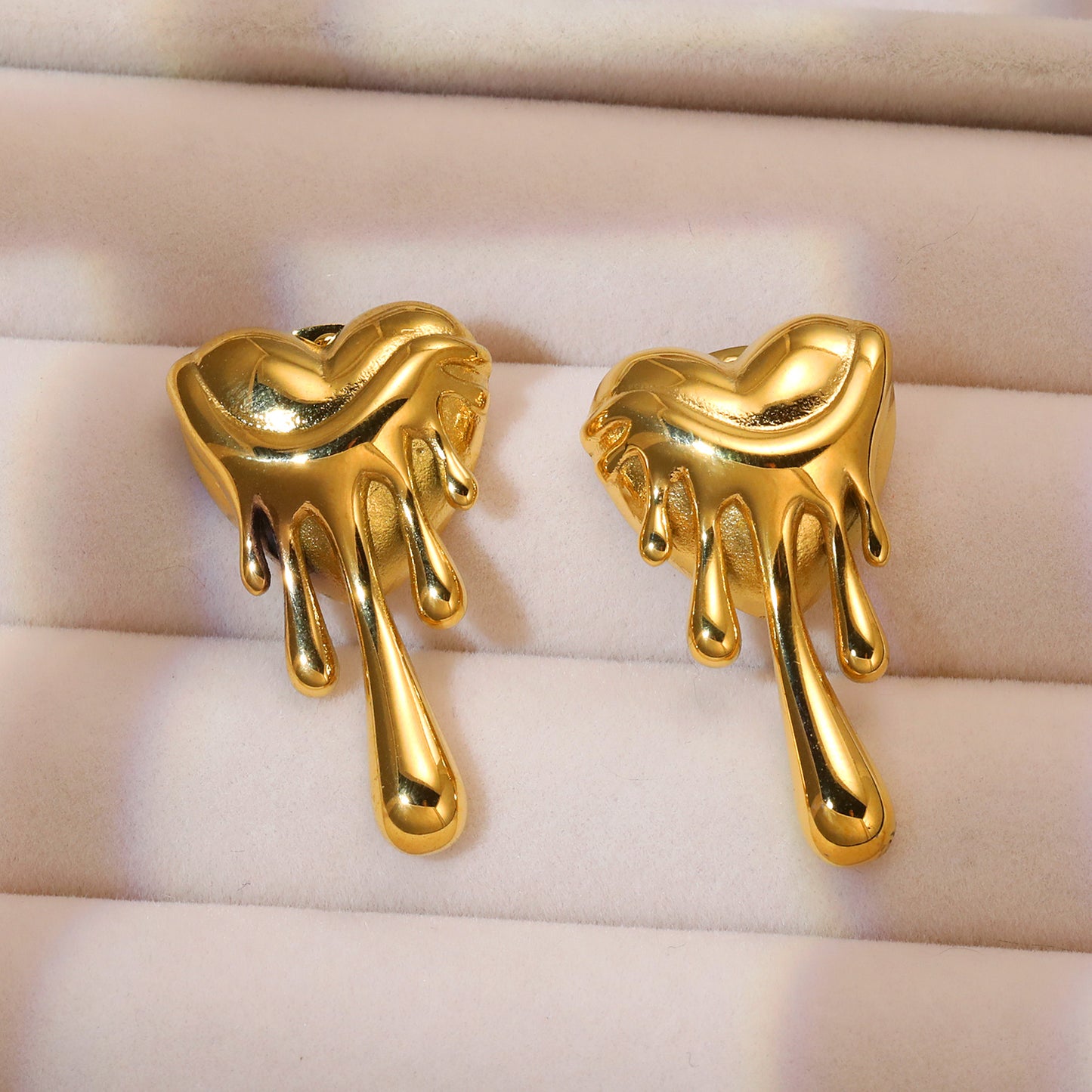 Gold plated melting heart drop earrings for women, bold statement jewellery design perfect for party wear and casual looks