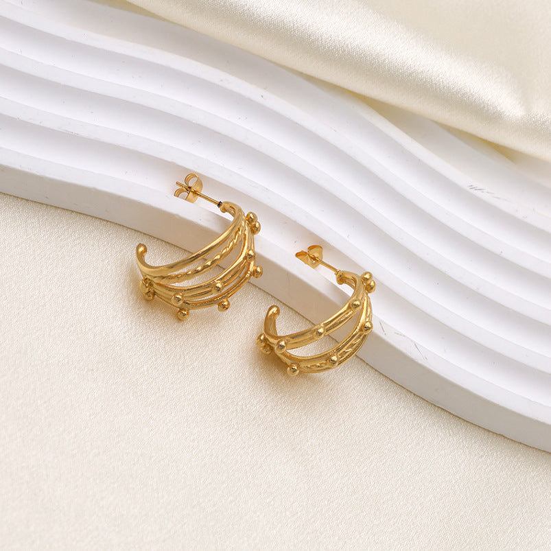Trendy gold hoop earrings with crescent layered design, stylish statement jewelry for weddings and festive occasions
