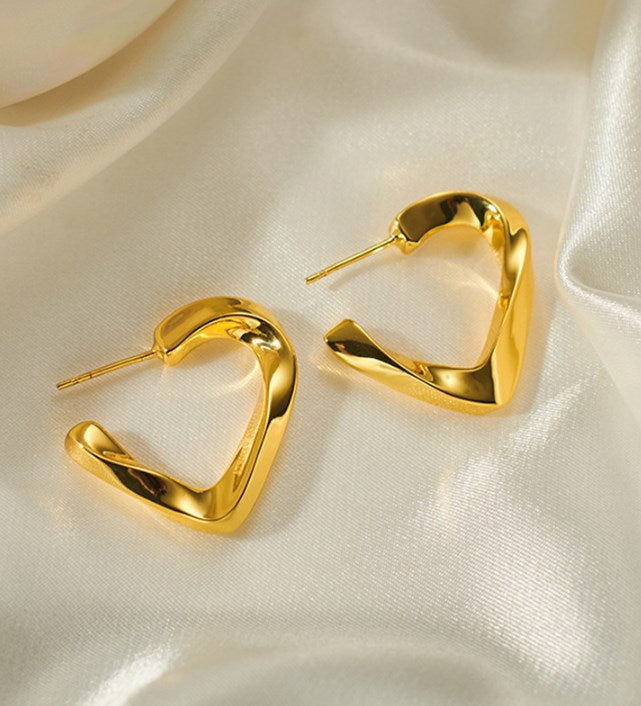 Stylish gold heart-shaped earrings for women, elegant lightweight jewelry perfect for daily and party wear.