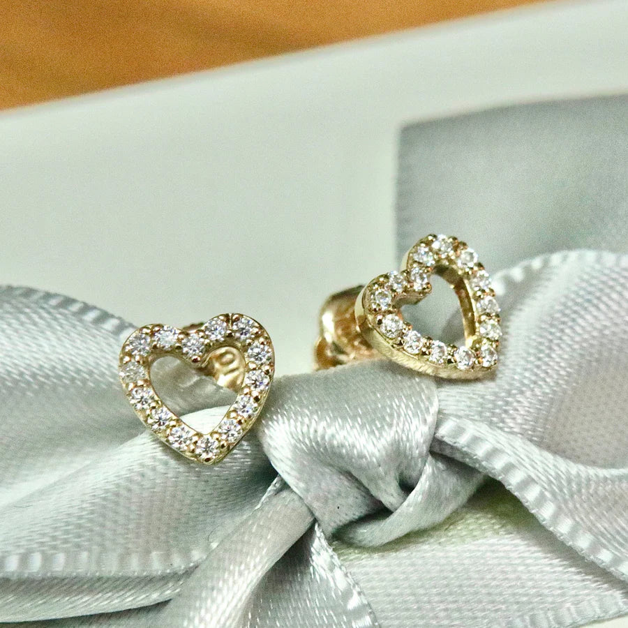 Gold open heart stud earrings encrusted with sparkling cubic zirconia stones, perfect for romantic and elegant looks.