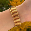 Stylish gold plated spiral bangle – adjustable and comfortable, perfect for adding a chic touch to your everyday wear or party outfits.