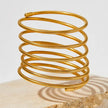 Trendy gold plated spiral cuff bangle – bold, adjustable, and stylish statement jewelry that perfectly complements both party outfits and casual looks.