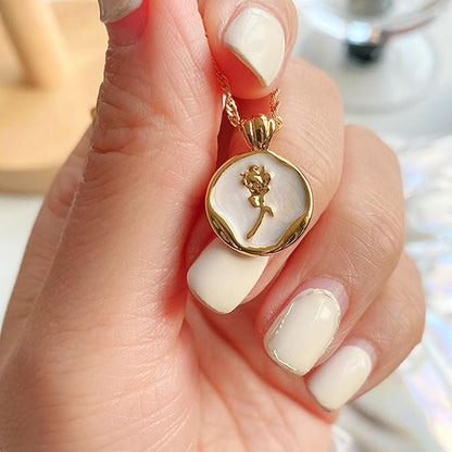 Elegant gold plated pendant necklace with white enamel round locket featuring a delicate rose flower design, minimal jewelry for women