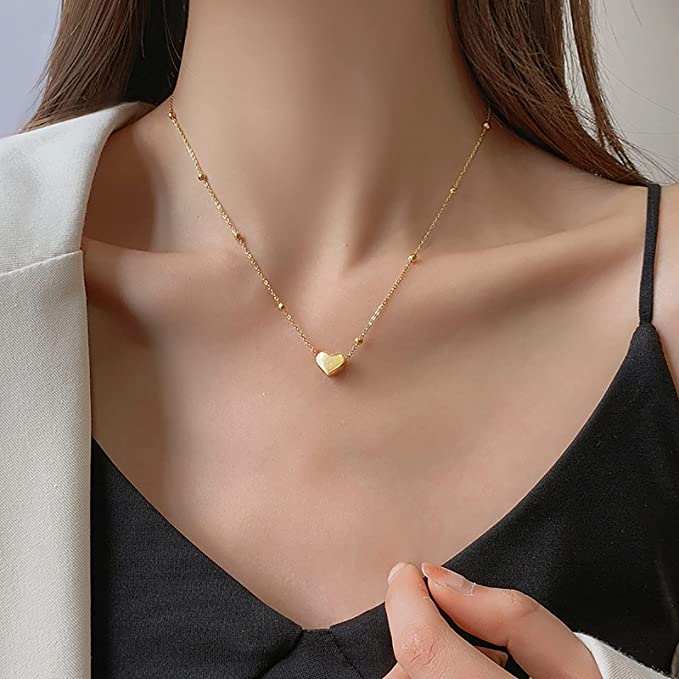 Minimalist gold plated heart pendant necklace for women, elegant lightweight jewelry perfect for daily wear and gifting.
