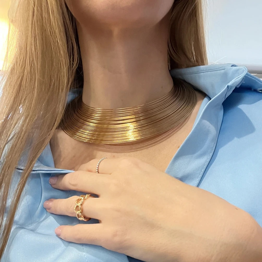 Model wearing layered gold plated choker necklace with matching ring – Glampouch jewelry
