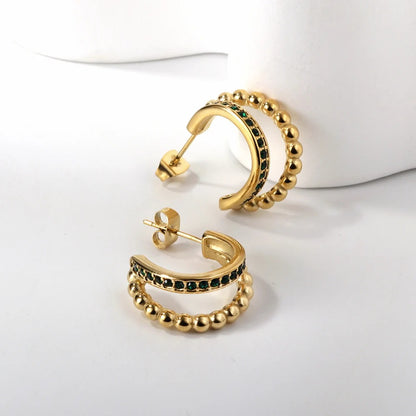 Trendy golden beaded hoop earrings with green stone studded design, elegant lightweight jewelry for women’s festive and daily wear.