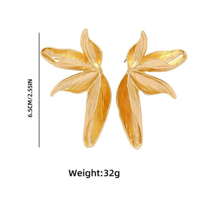 Gold leaf-shaped earrings with measurements and weight information on a white background