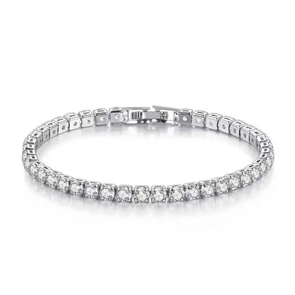 Silver bracelet with clear stones on a white background