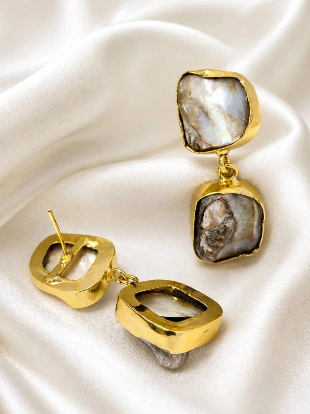 Back view of baroque pearl drop earrings showing gold push-back post and bezel construction