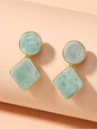 Pair of mint green amazonite geometric drop earrings with gold bezel on a peach surface