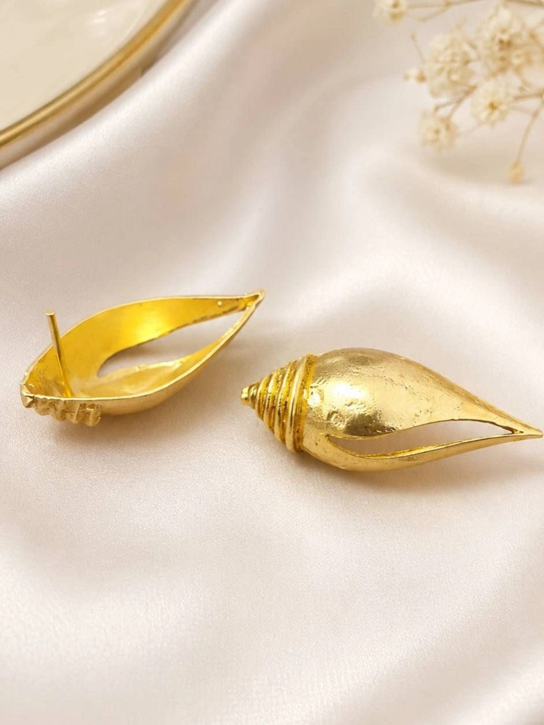 Back view of gold-plated shell earrings showing push-back stud post and hollow interior
