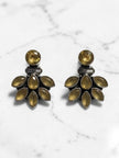 Pair of oxidised silver ear jacket studs with yellow marquise stones on a white marble surface