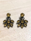 Oxidised silver citrine ear jacket earrings laid flat on a light wooden surface showing full fan detail