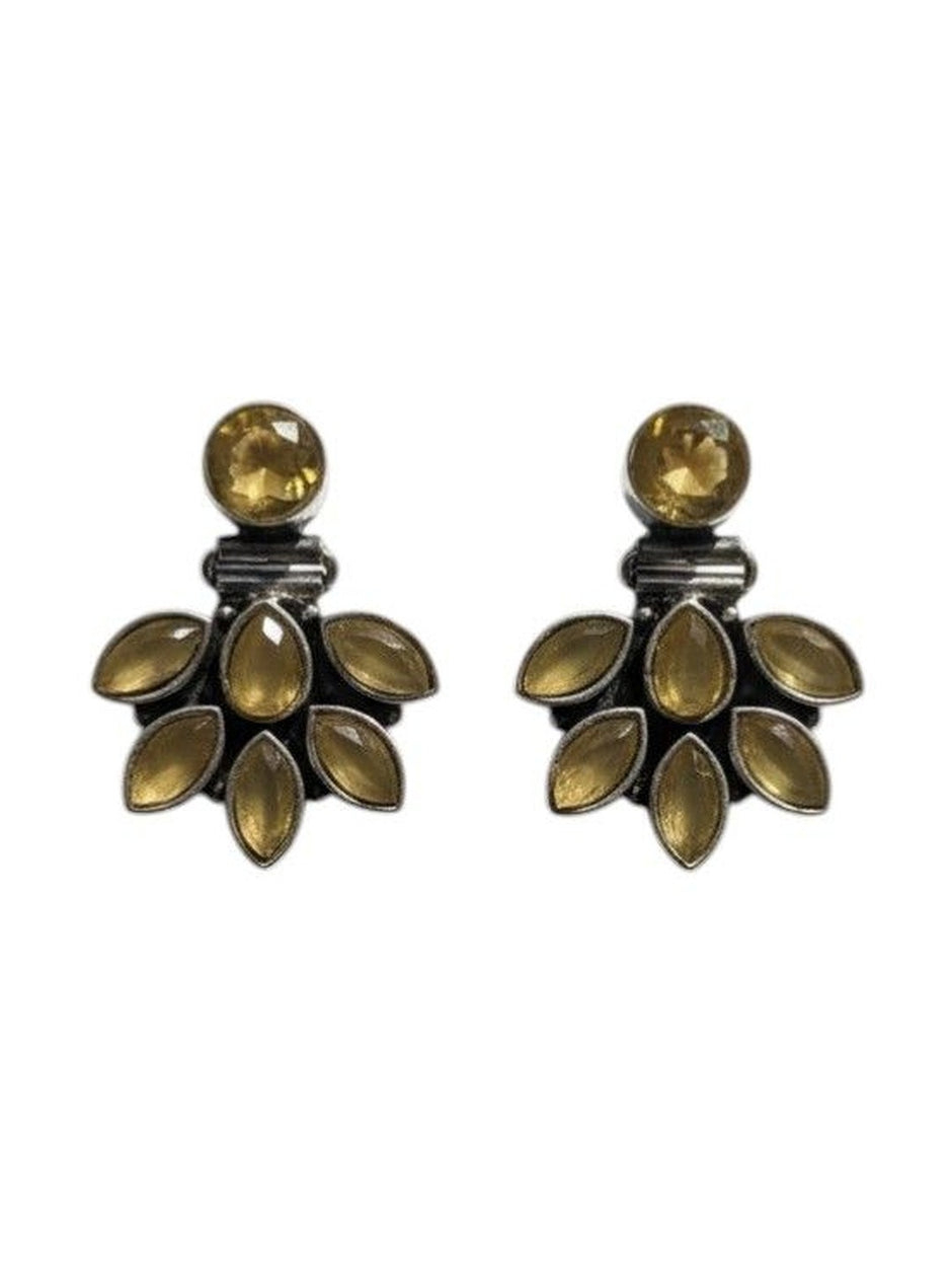 Front-facing pair of oxidised silver and yellow stone ear jacket studs on a clean white background