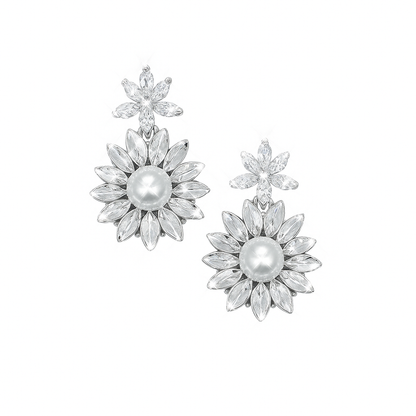 Silver floral earrings with pearls on a white background