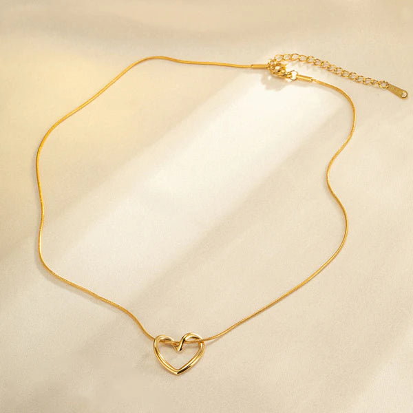 Elegant gold plated heart pendant necklace for women, perfect fashion jewelry for parties and everyday style.