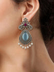 Oxidised silver elephant teardrop earring worn on a woman's ear showing full length and pearl drop fringe