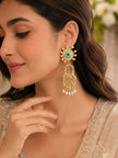 Woman wearing gold evil eye sunburst stud with padlock drop earring and pearl fringe