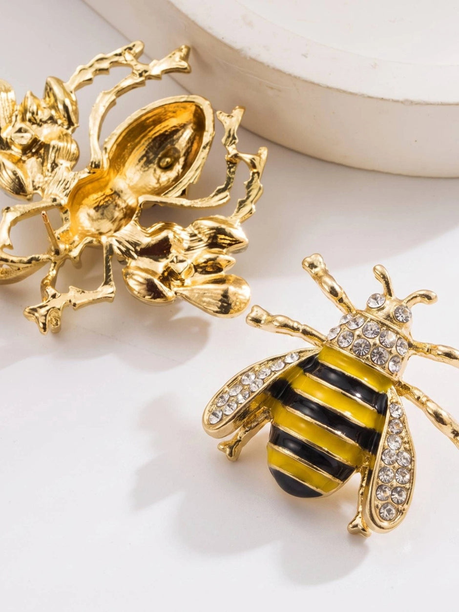 Close-up of bee stud earring back detail showing gold-tone casting and stud post mechanism