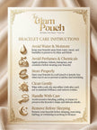 The Glam Pouch branded bracelet care instruction card listing six maintenance tips on cream satin fabric