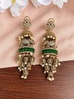 Front view of both antique gold elephant jhumka earrings laid flat on blush fabric with white flowers, showing full tiered design