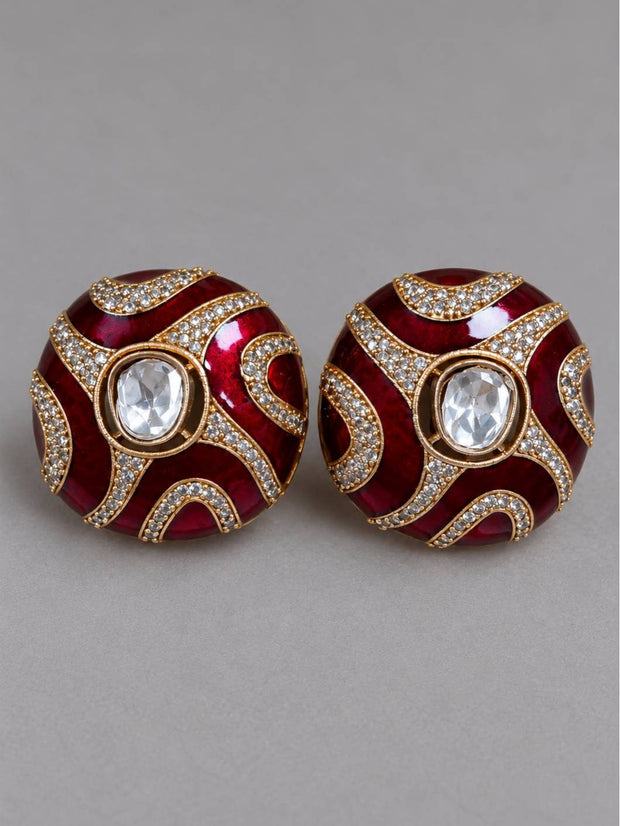 Front view of both red enamel kundan dome studs with crystal pavé detailing against a neutral grey background