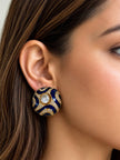 Blue enamel kundan dome stud earring worn on model's ear showing scale and fit against skin