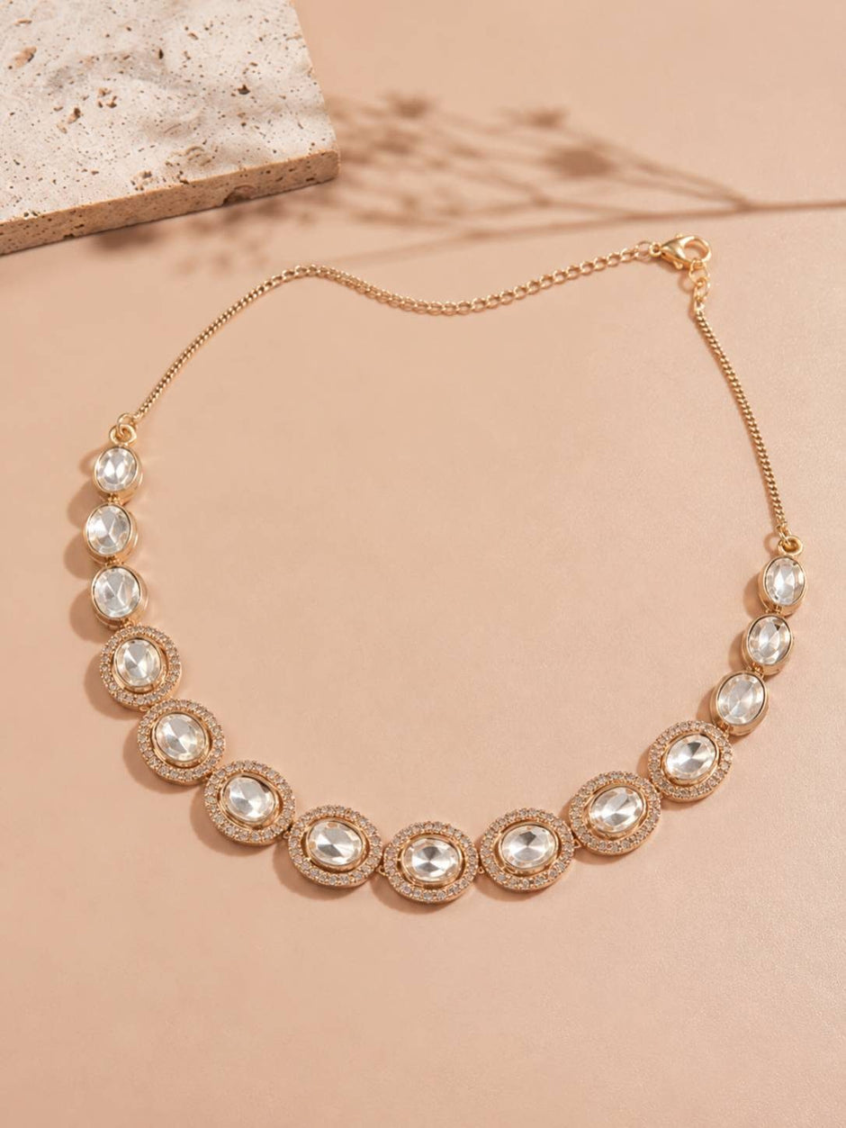 Rose gold oval kundan stone necklace laid flat showing full length and lobster clasp extender