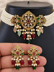 Gold kundan choker necklace displayed on a black jewellery bust with matching stud earrings held in hand