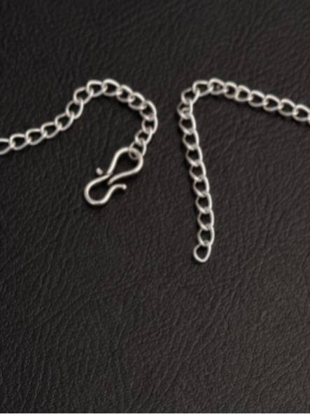 Close-up of S-hook clasp and adjustable extender chain for the oxidised silver choker necklace