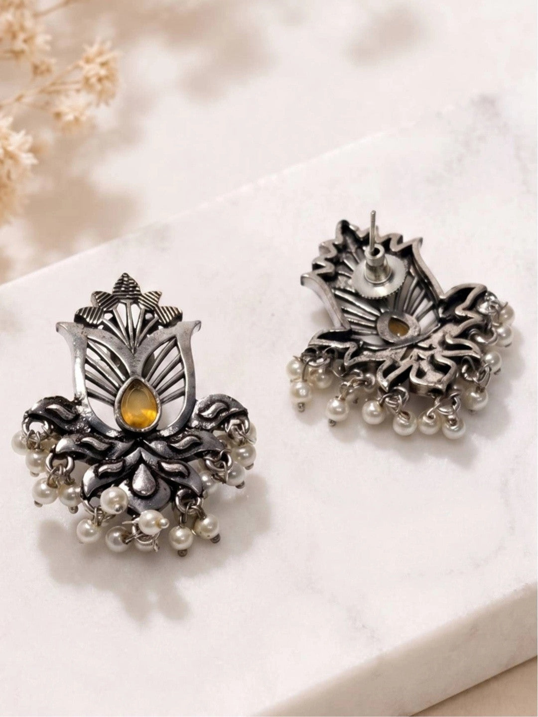 Front and back view of oxidised silver lotus earrings showing stud post and pearl drop detail