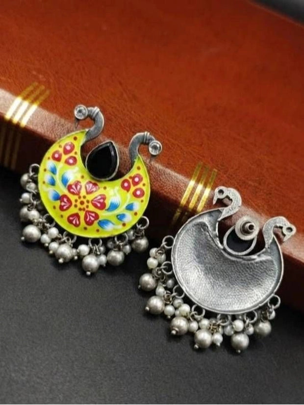 Front and back view of meenakari chandbali showing painted face and plain oxidised silver reverse